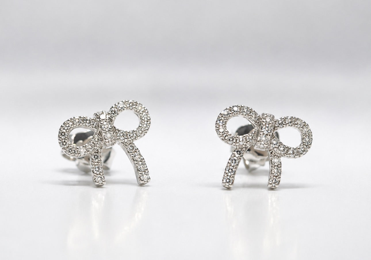 14K, white gold, .13 carat total weight, natural diamond bow earrings.