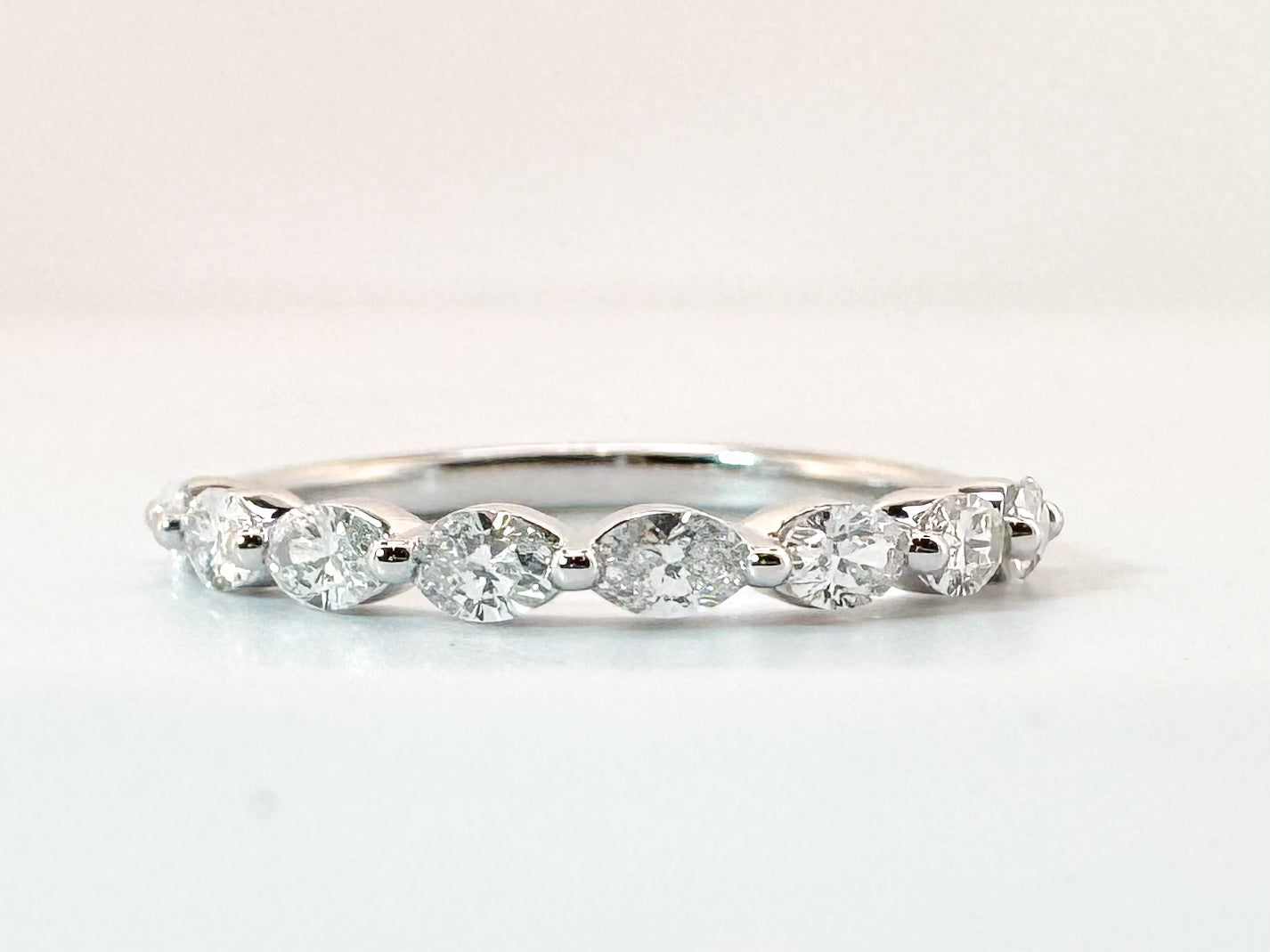 14K, White gold, .60 carat total weight, side ways oval band. VS2 G