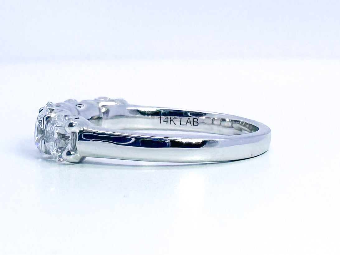 14K, white gold, 5 diamond band 1.50 diamond total weight. Lab grown