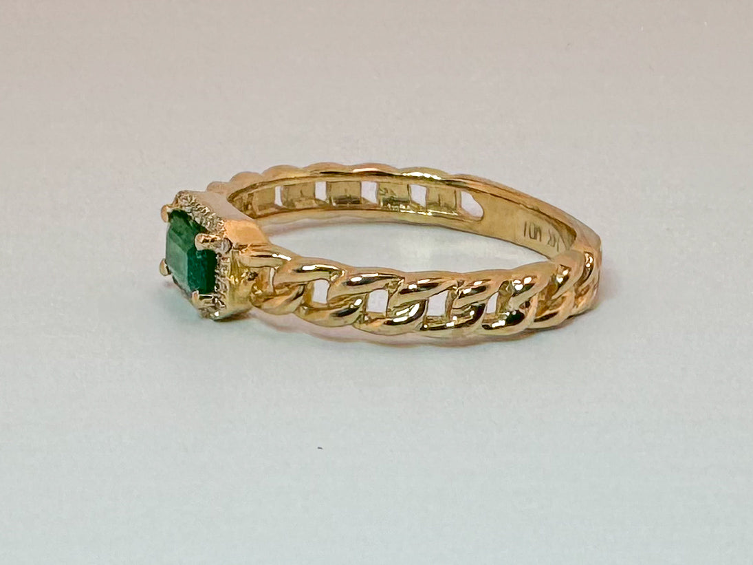 14k, yellow gold, .30 carat natural Emeald set with .05 diamond halo. Link style fashion ring
