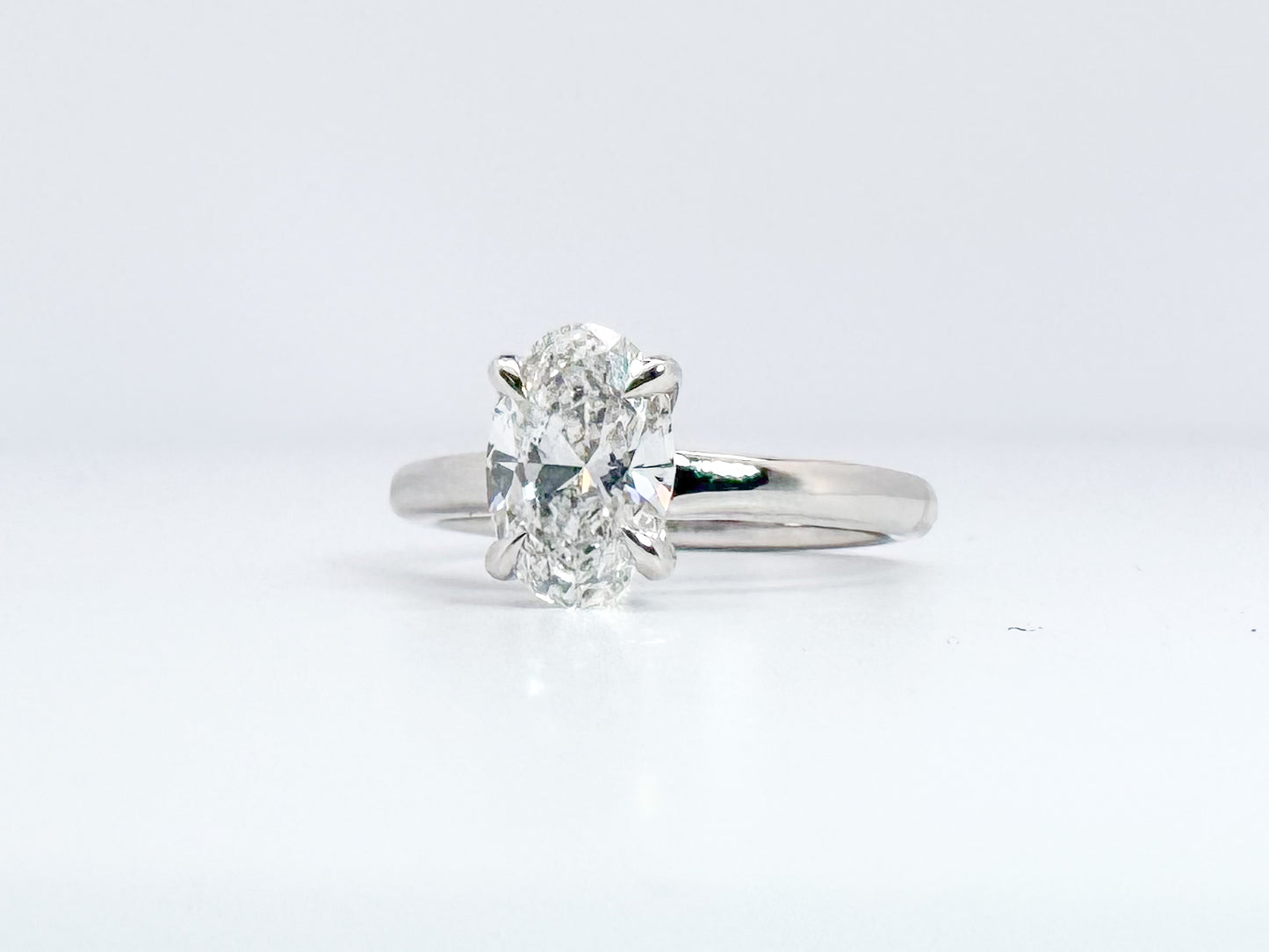 14kw 1.50 E VS1 Lab grown oval diamond engagement ring. IGI certified