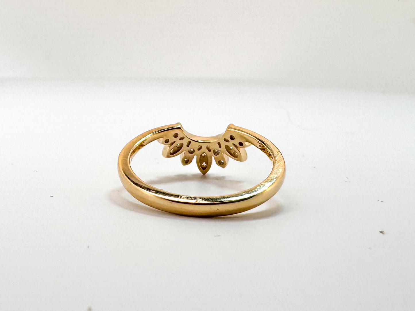 14K, Yellow gold, .16 carat total weight diamond curved band.