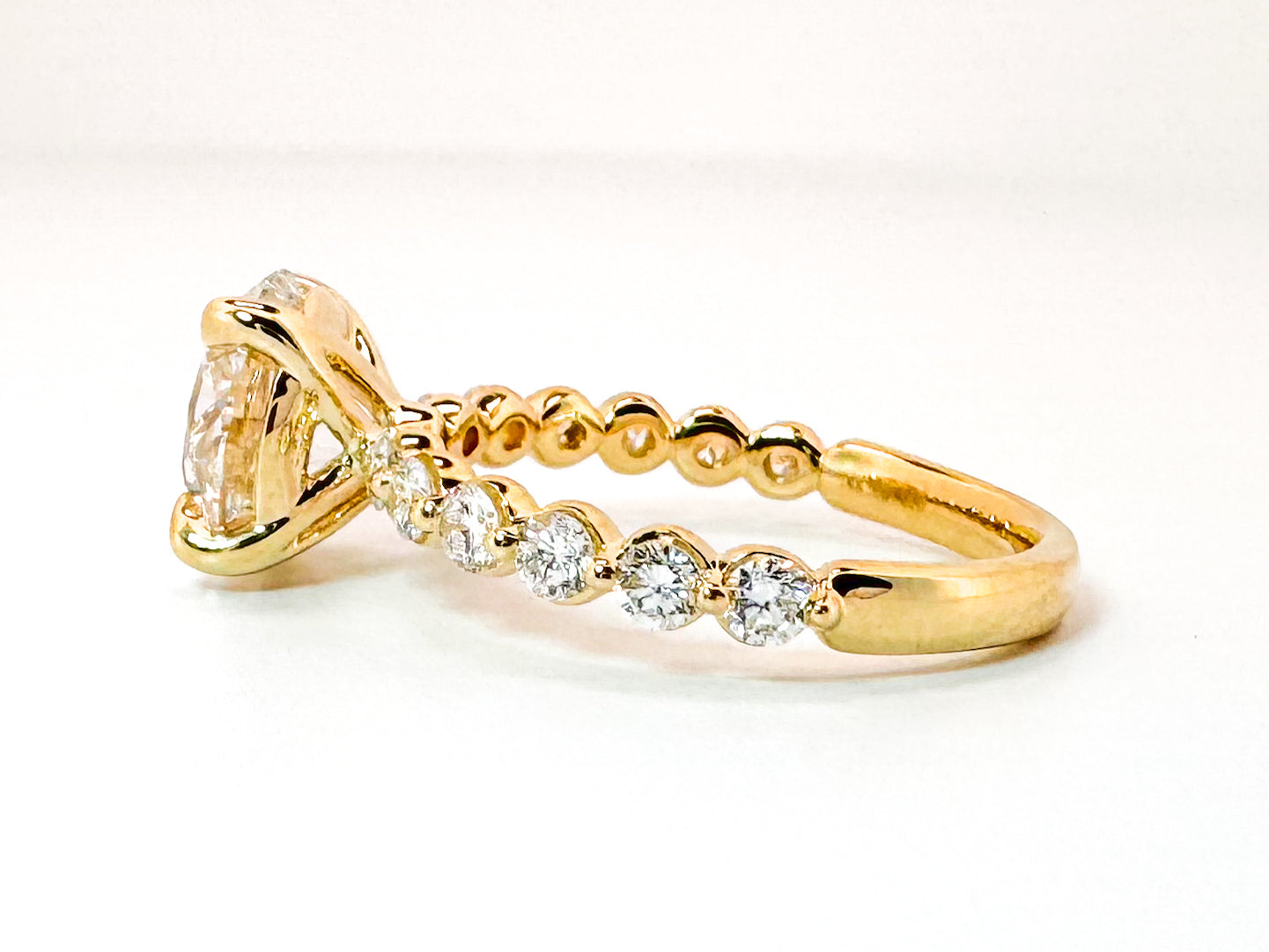 14K, Yellow gold 3.05 lab grown round brilliant engagement rint with .53 carats of side diamonds. IGI cert