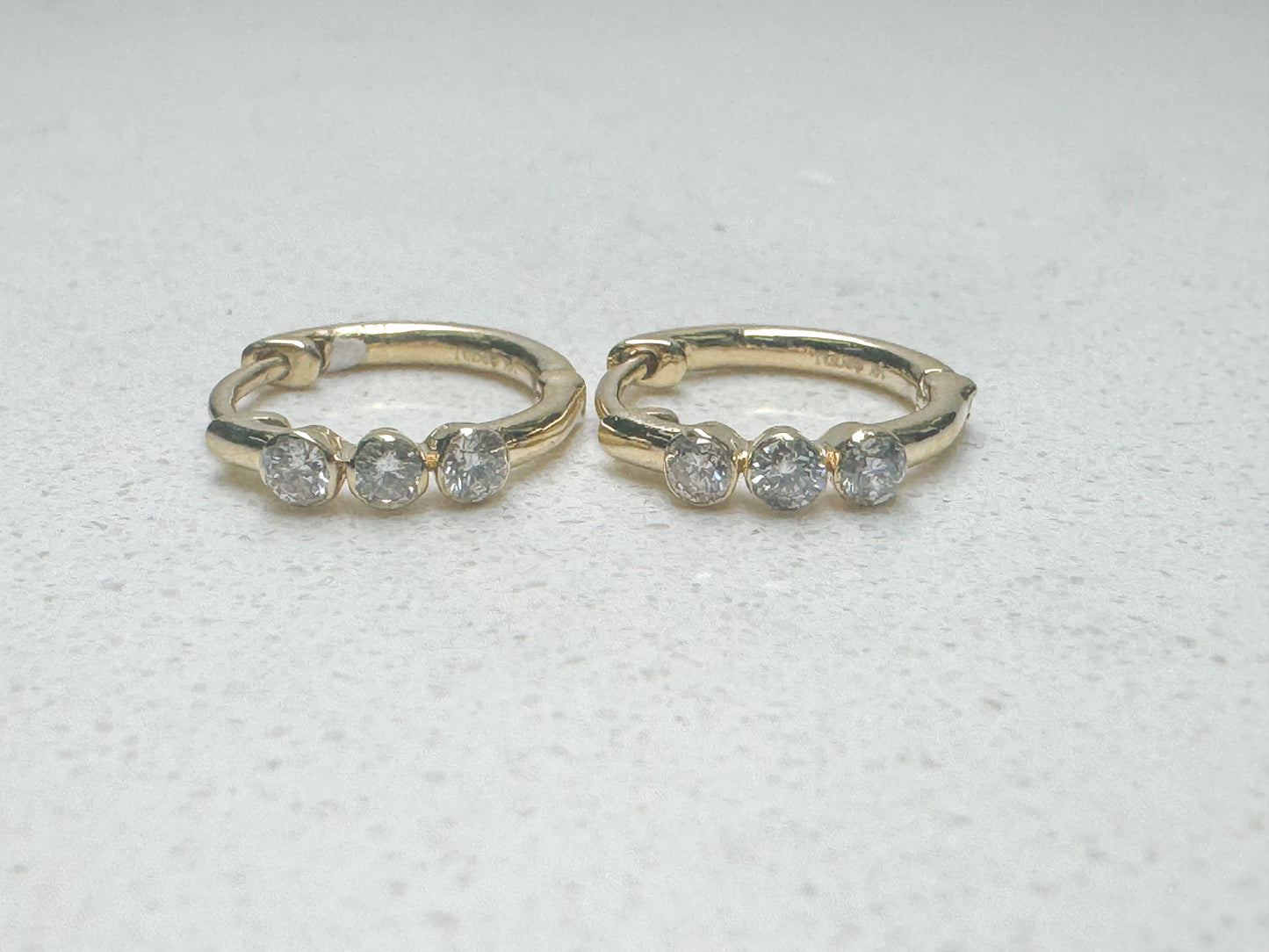 14k yellow gold, micro bezel, huggie earring.