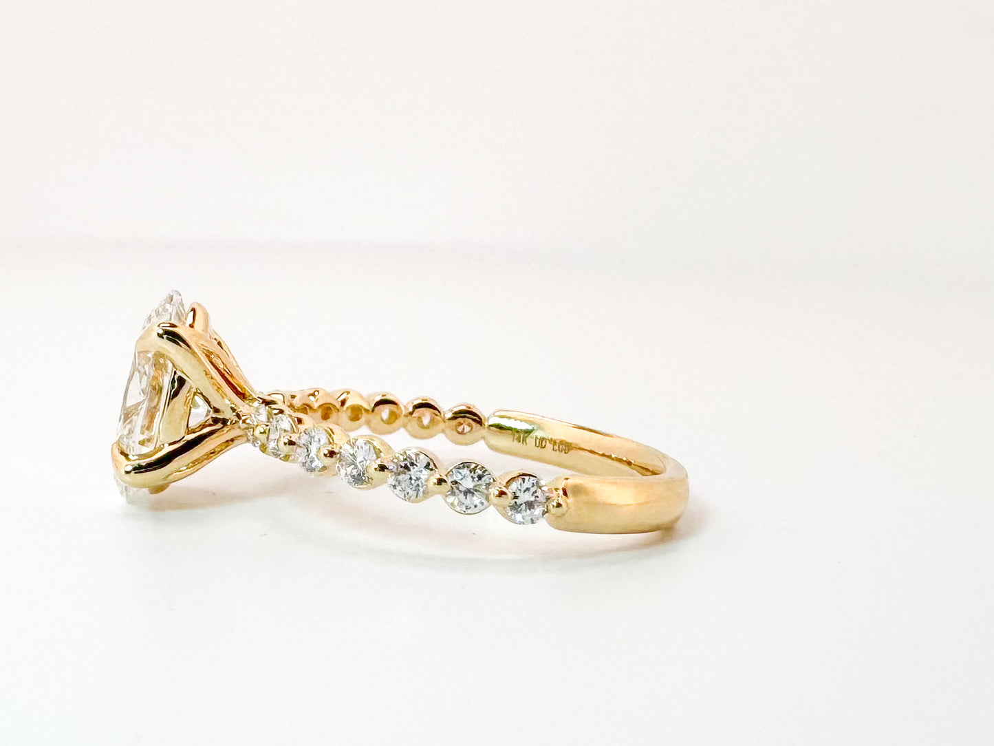 14K, Yellow gold, 2.04 carat, Lab grown oval diamond,  set with .35 carats of side diamonds. IGI Certified