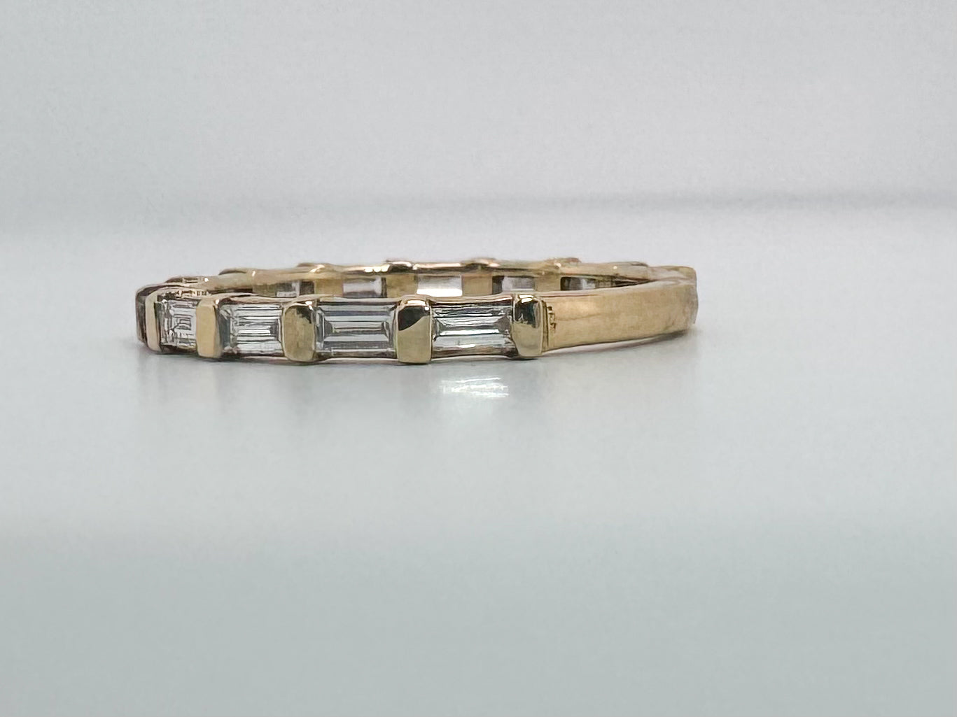 14k, yellow gold, .63 carat total weight. baguette and diamond
