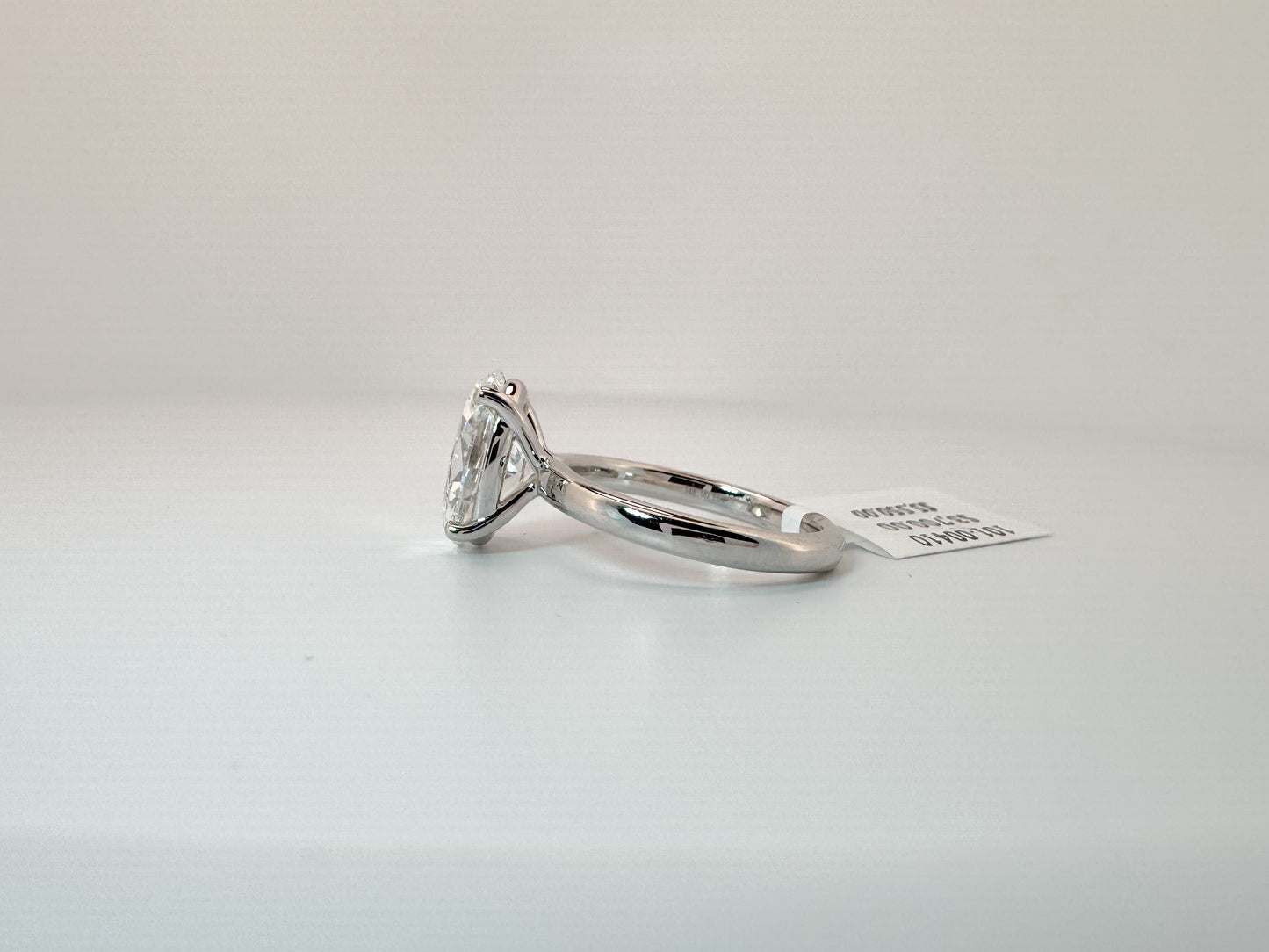 14k, White gold solitaire, set with 4.02 carat lab grown oval diamond. GIA Certified. VS1 E
