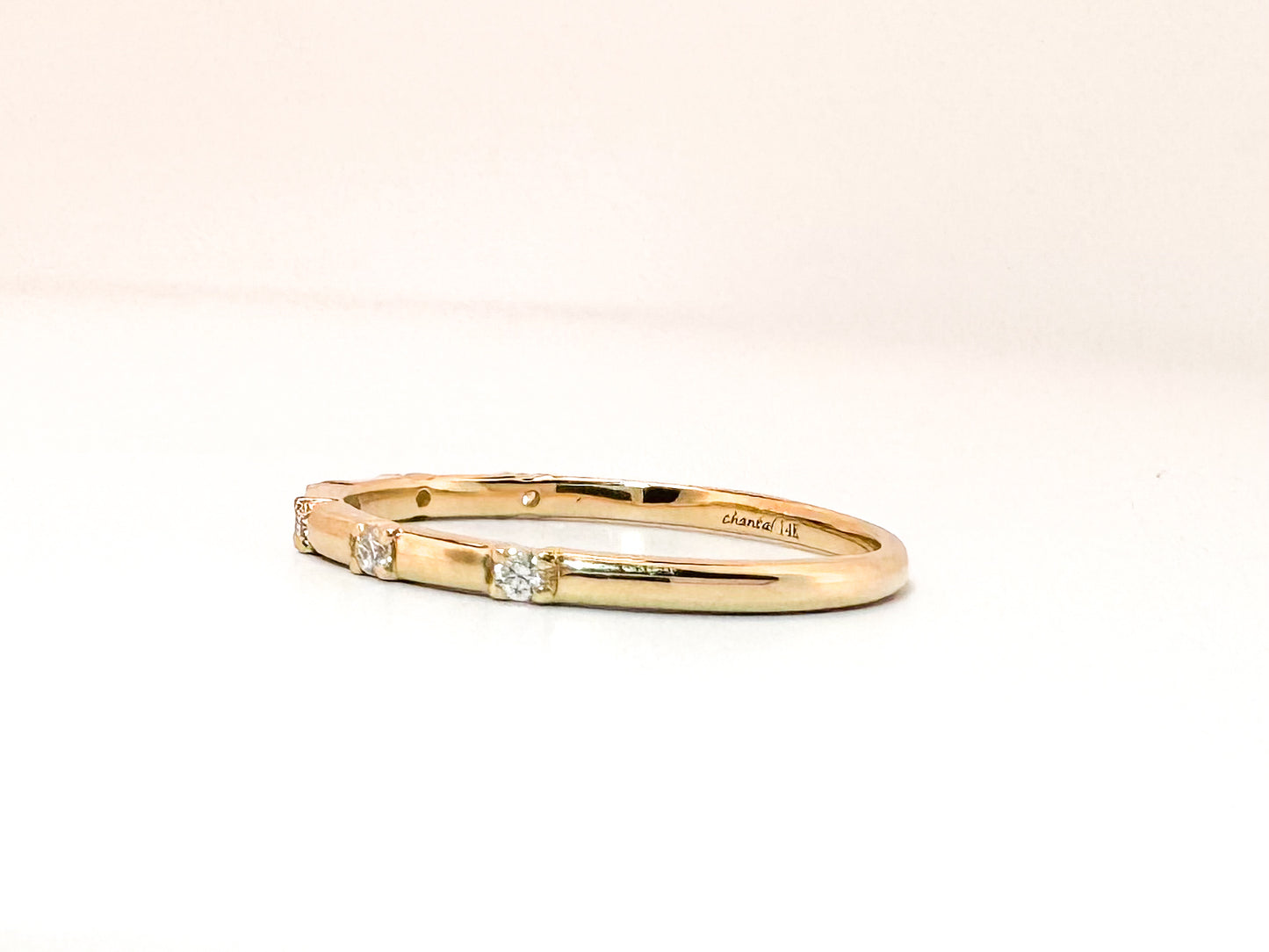 14k, yellow gold .06 diamond total weight, wedding band.
