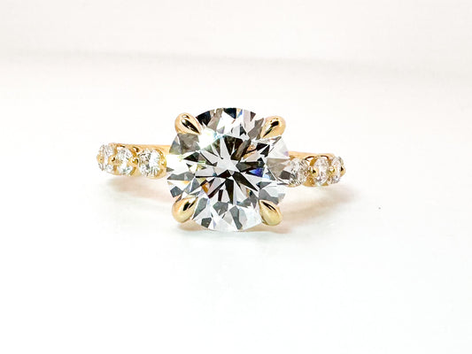 14K, Yellow gold 3.05 lab grown round brilliant engagement rint with .53 carats of side diamonds. IGI cert