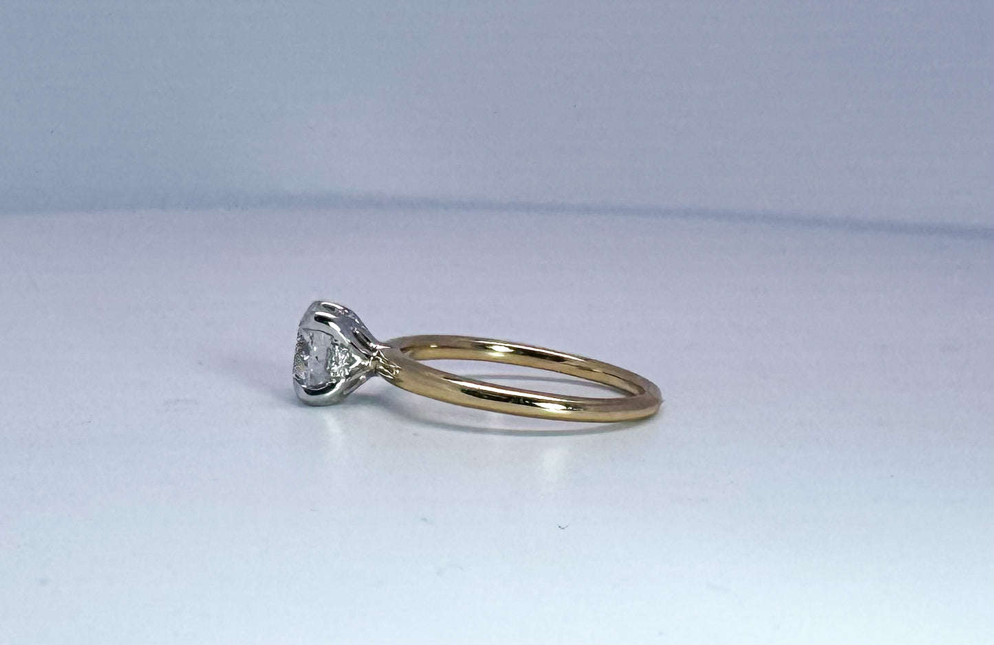 14k two tone 1.21 ideal cut round brilliant, F SI1, set in solitaire with hidden halo