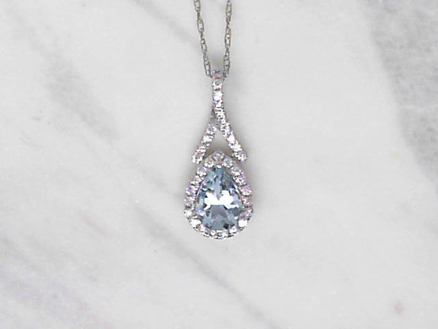 Aquamarine and diamond halo pendant