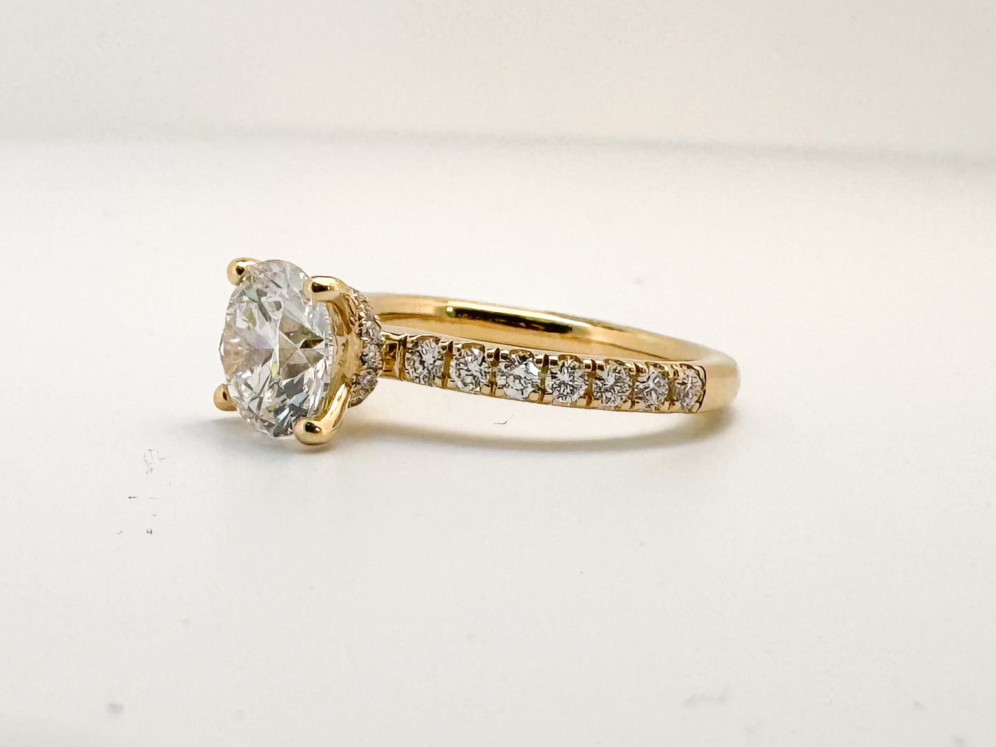 14K, Yellow gold, 2.01 lab grown round brilliant VS1 F, set with .49 side diamonds. IGI certified