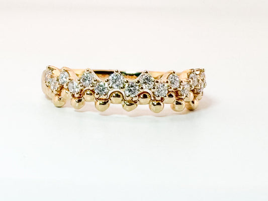 14K, yellow gold jaggad diamond band. .33 diamond total weight.