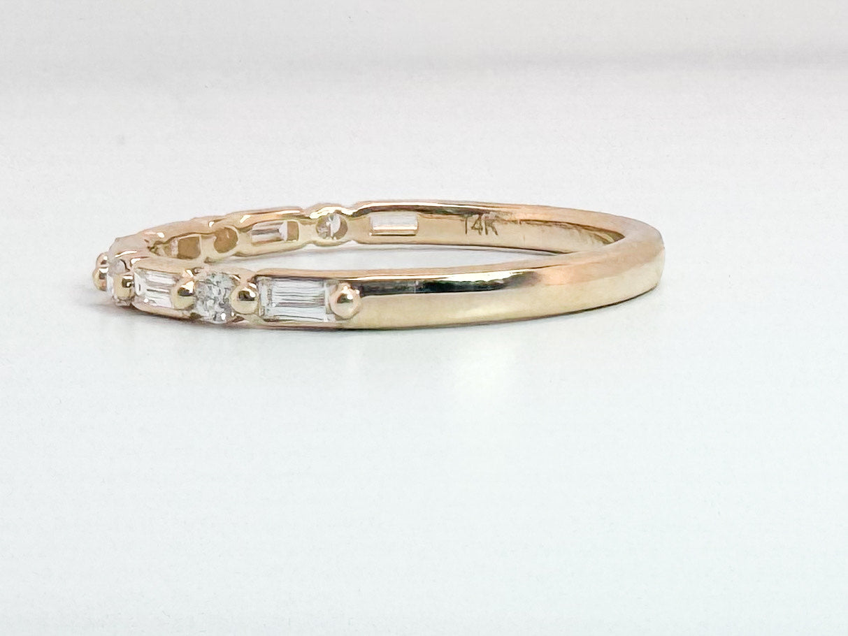 14k, yellow gold, baguette and round brilliant diamond wedding band. .25 carat total weight.