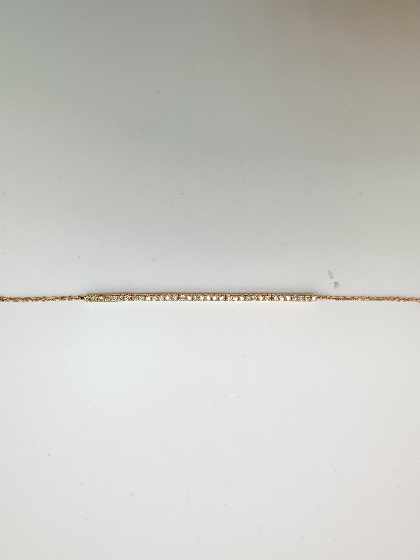 14K, Yellow gold .23 diamond total weight, bar style tennis bracelet. 7.5"