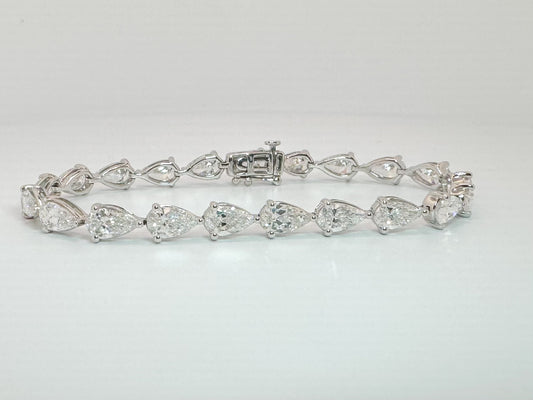 14k, white gold 11.13 diamond total weight pear shaped lab diamond bracelet. SI1 G