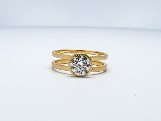 14k yellow gold split shank diamond ring with satin finish.