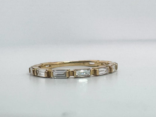 14k, Yellow gold, .60 natural diamond total weight. Baguette diamond band.