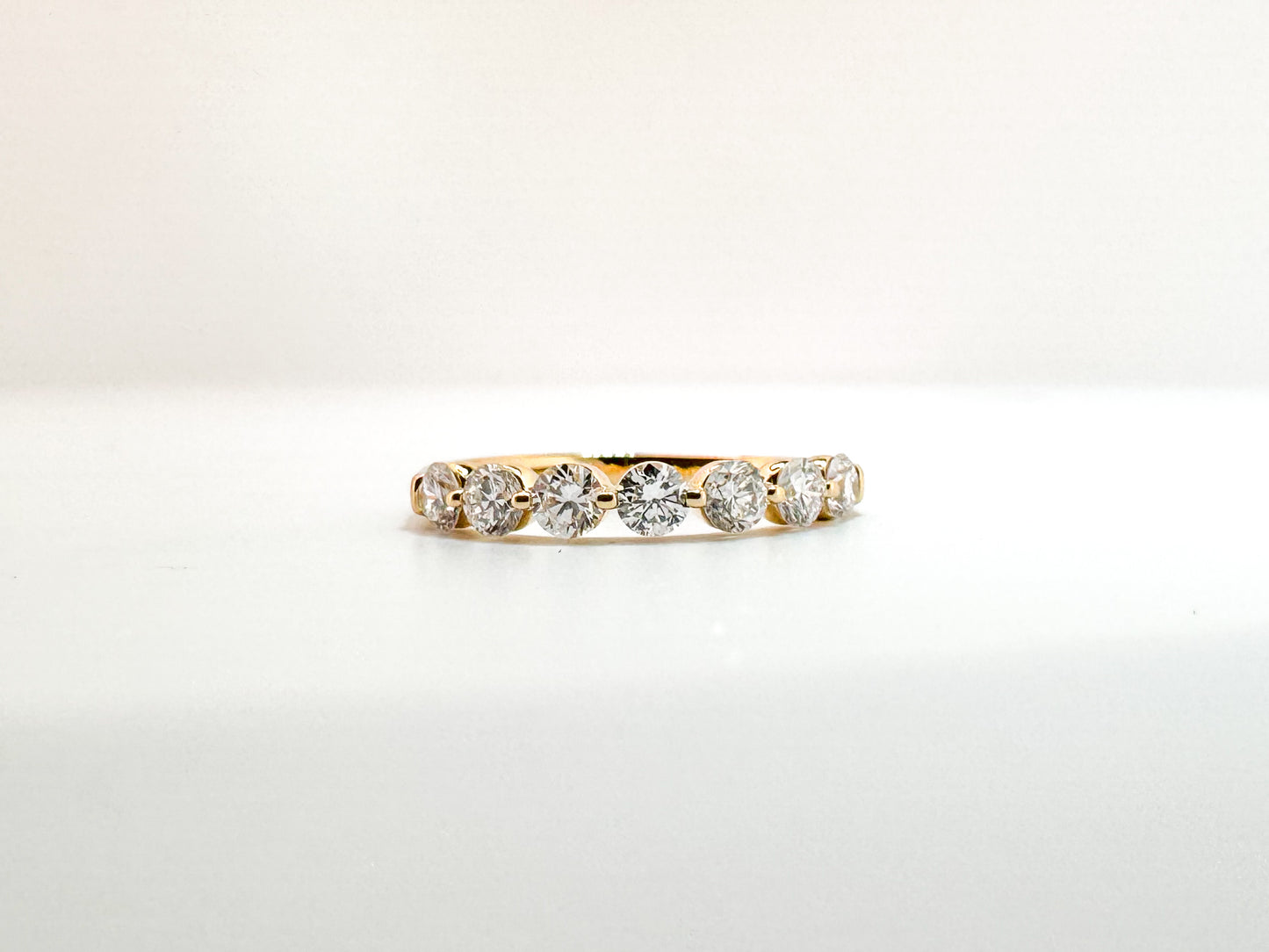 14K, Yellow gold, 1.00 carat total weight, shared, single prong lab grown diamond band.