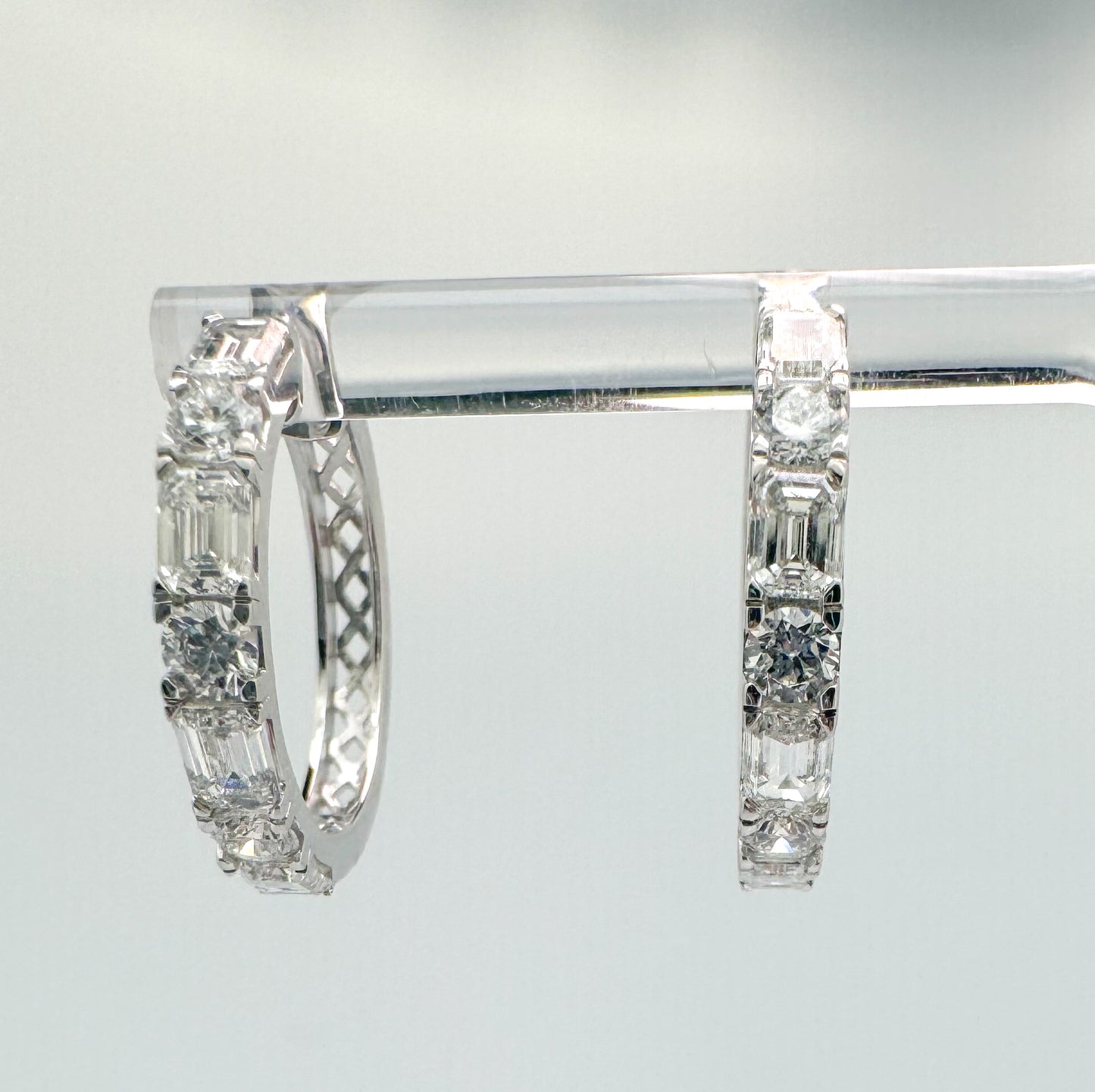 14K, White gold, 3.64 carat total weight, lab grown emerald cut and round brilliant diamond hoop earrings.