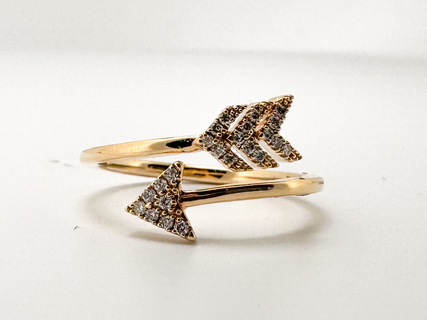 14K, Yellow gold, natuiral diamond aarow fashion ring. .10 carat total weight.
