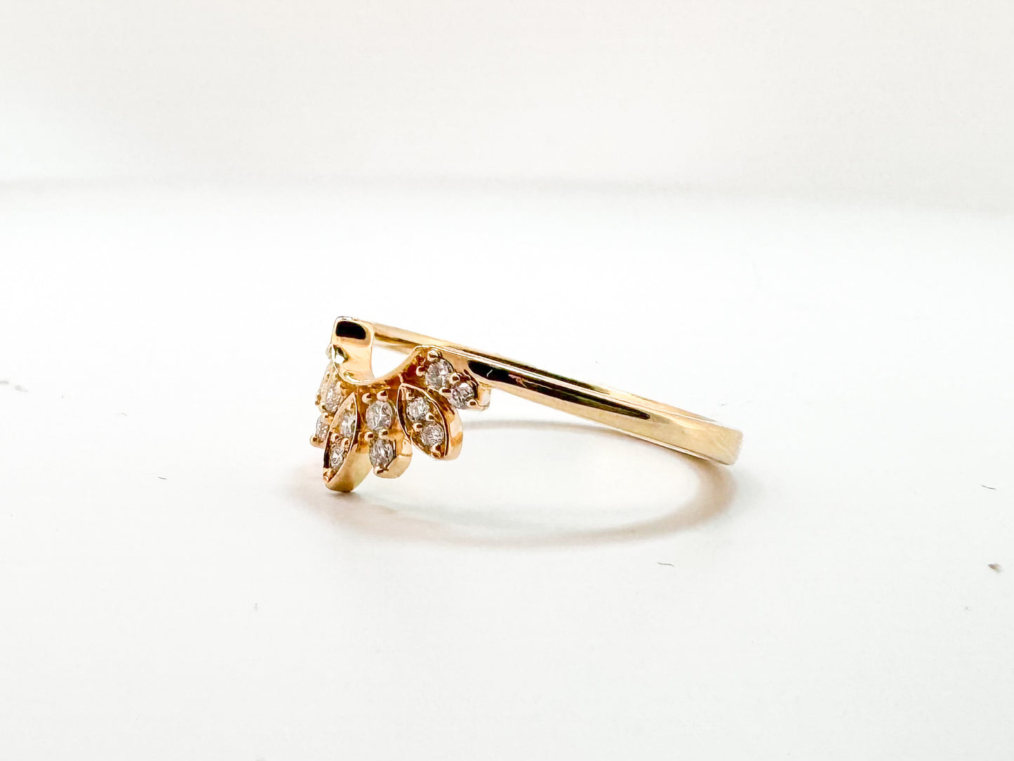 14K, Yellow gold, .16 carat total weight diamond curved band.