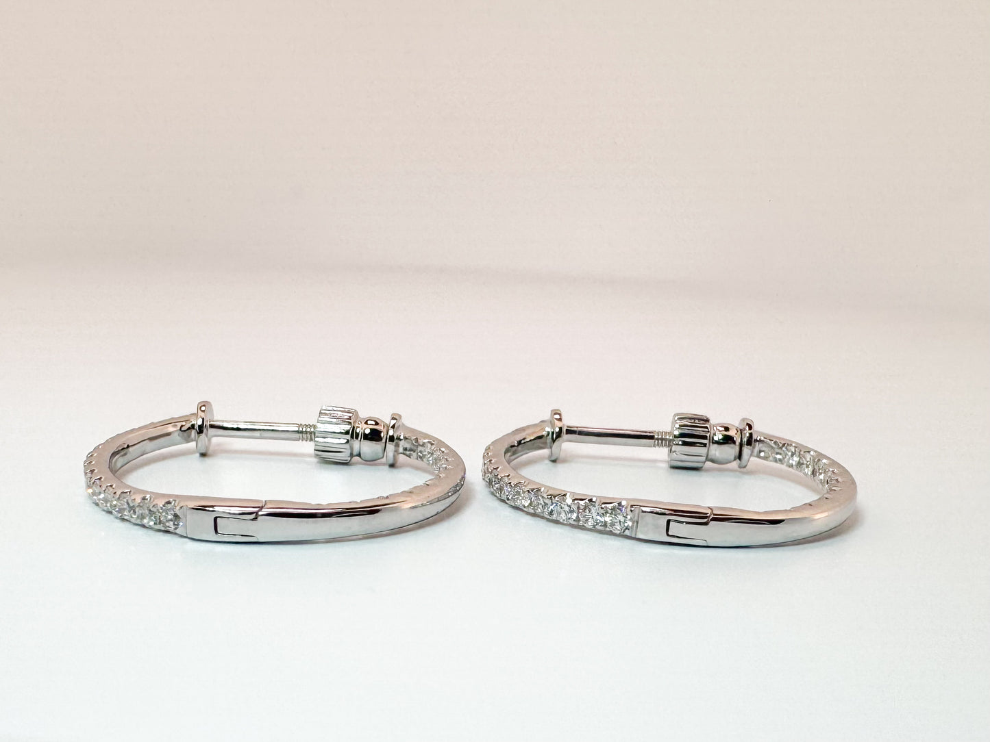 14k, white gold, .60 diamond total weight, inside out, hoop earring with screw backs.