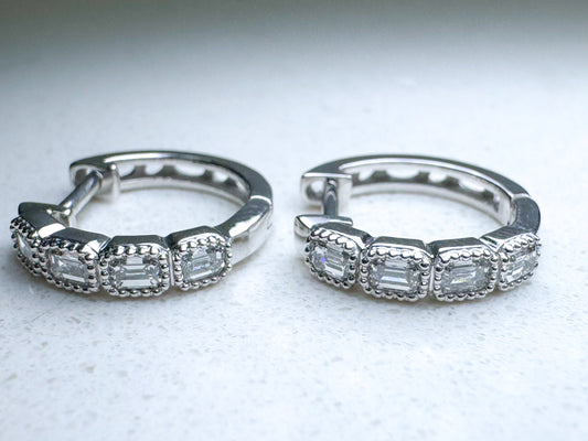 14k white gold, vintage vibe, .55 total weight baguette huggie earring.