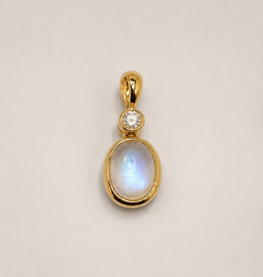 14ky .08 carat total weight,  1.27 ct moon stone and natural diamond  pendant.