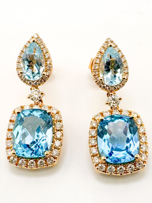 14k, Yellow gold, blue topaz and diamond dangle earrings. .98 diamond total weight.