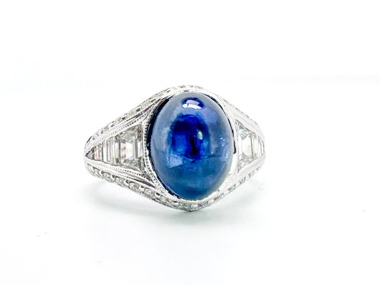 6.27 Carat, natural cabochon sapphire, set in custom hand engraved, 1.60 diamond total weight mounting.