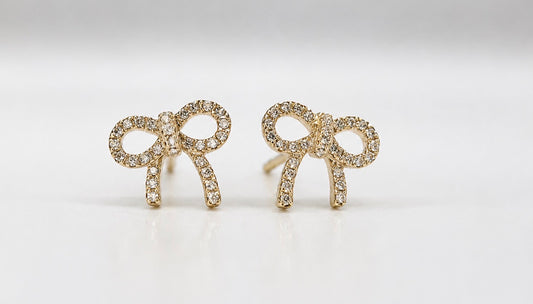 14K, yellow gold .14 carat total weight, diamond, bow earrings.