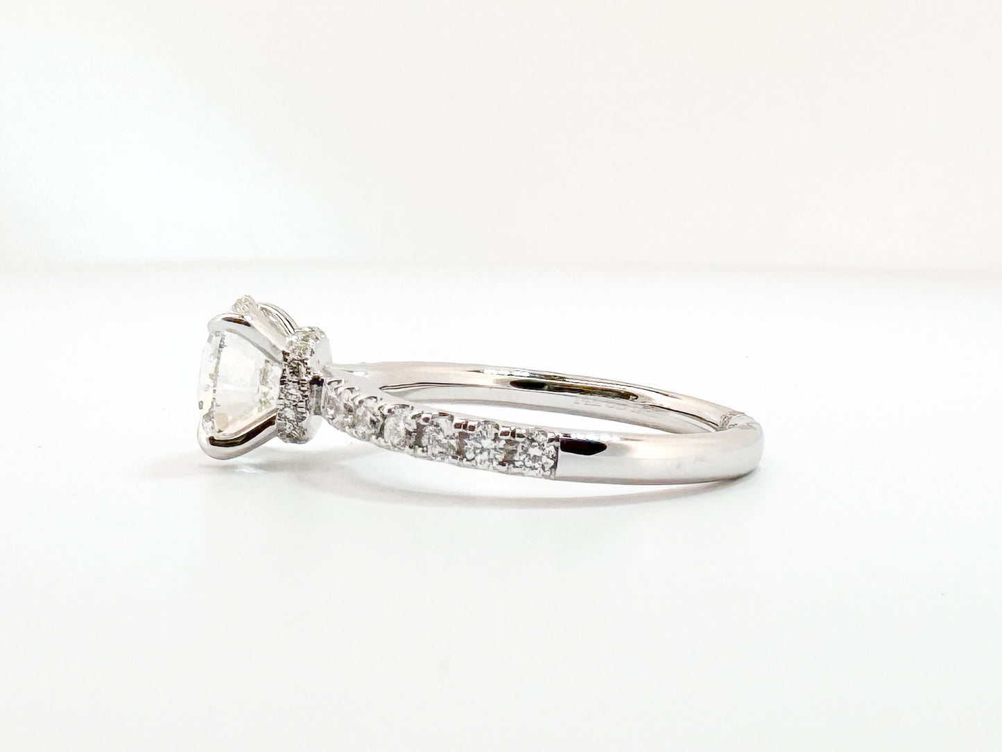 14K, white gold, 2.08 lab grown VS2 G Round brilliant set with .42 carats of side diamonds. IGI certified