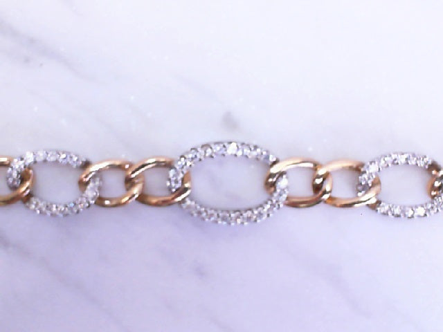 14k two tone  gold diamond link bracelet.