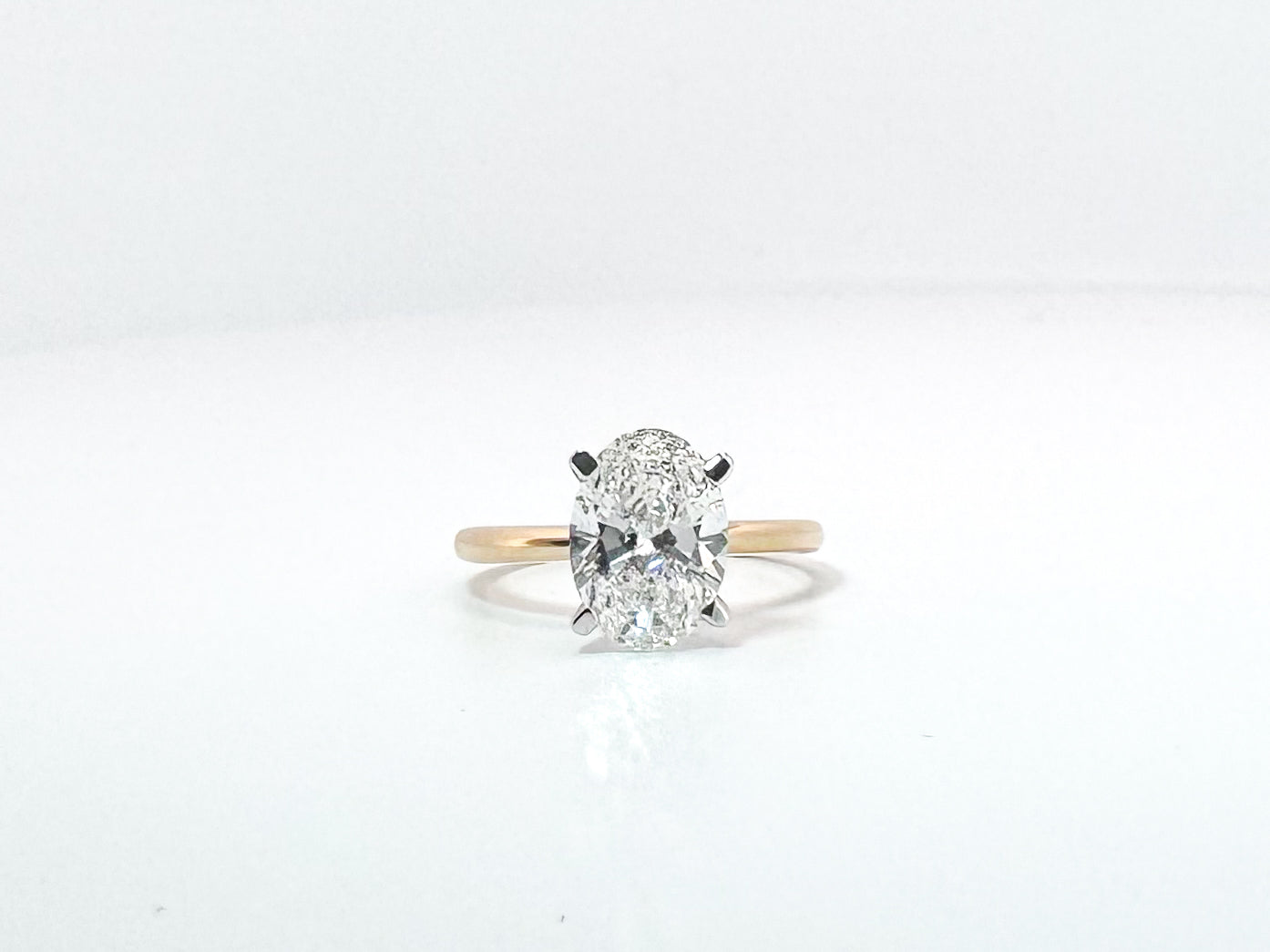 14K, 2.54 carat lab grown oval solitaire. VVS2 F IGI certified