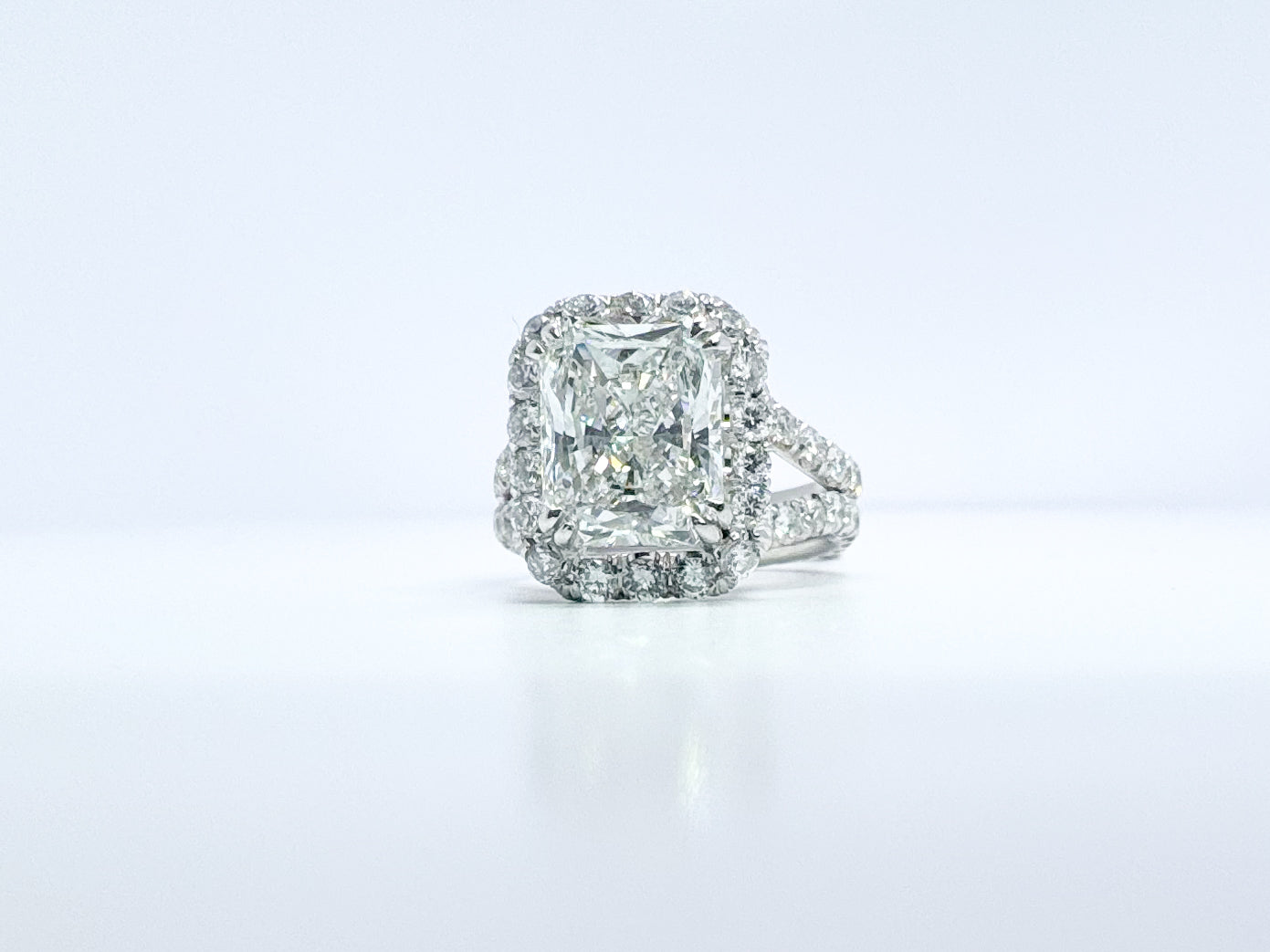Platinum, 3.54 Carat, natural cushion cut diamond set with 3.00 carats of side diamonds. GIA certified!