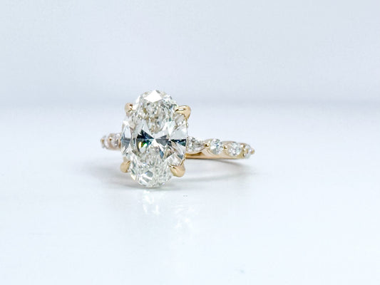14K, 3.08 VVS2 E Lab grown oval set with .33 side diamonds. IGI Certified