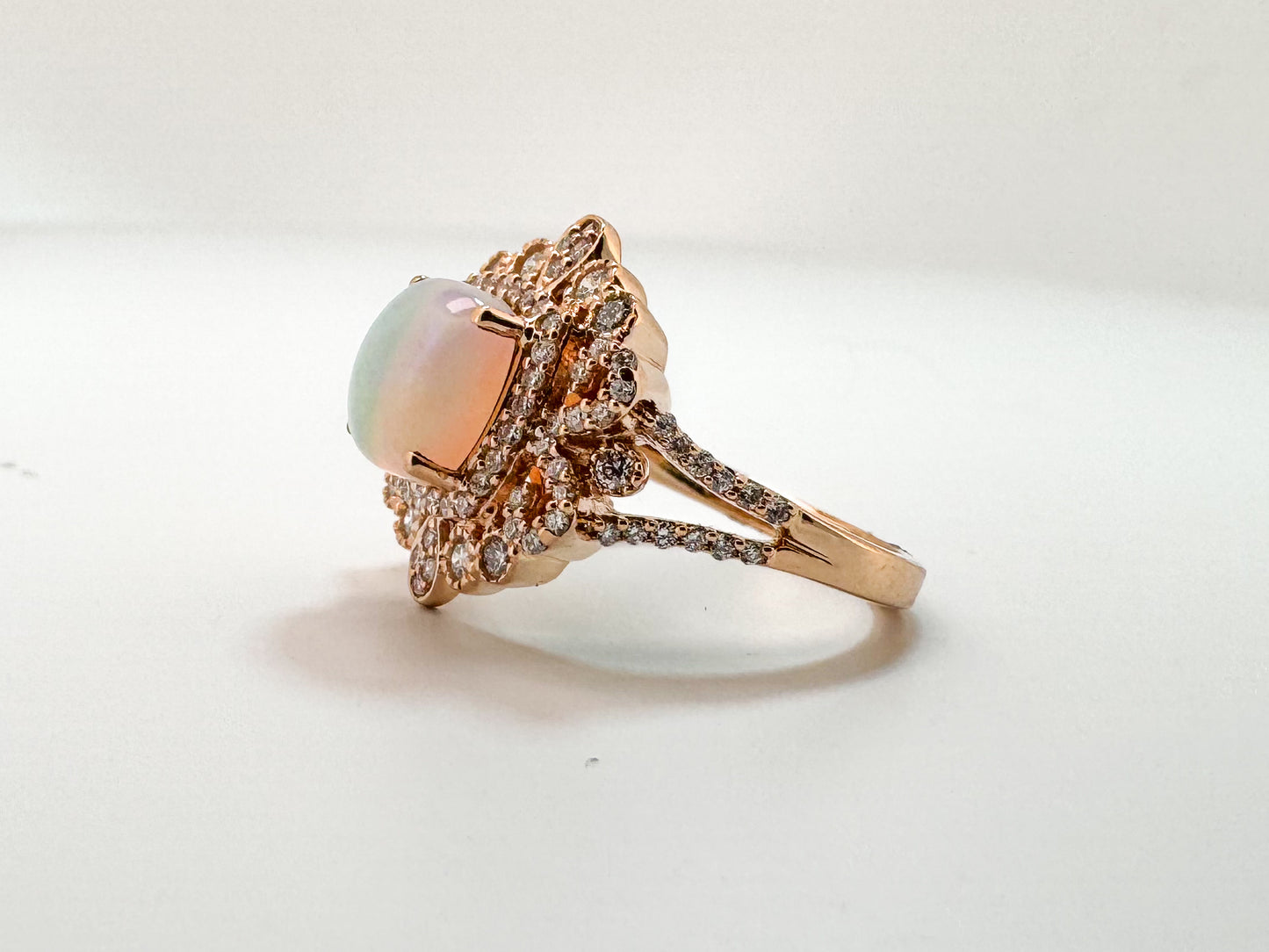 14k, Rose gold, 1.40 carat Ethiopian opal set with .60 carats of side diamonds.