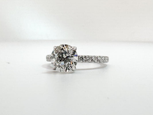 14K, white gold, 2.08 lab grown VS2 G Round brilliant set with .42 carats of side diamonds. IGI certified