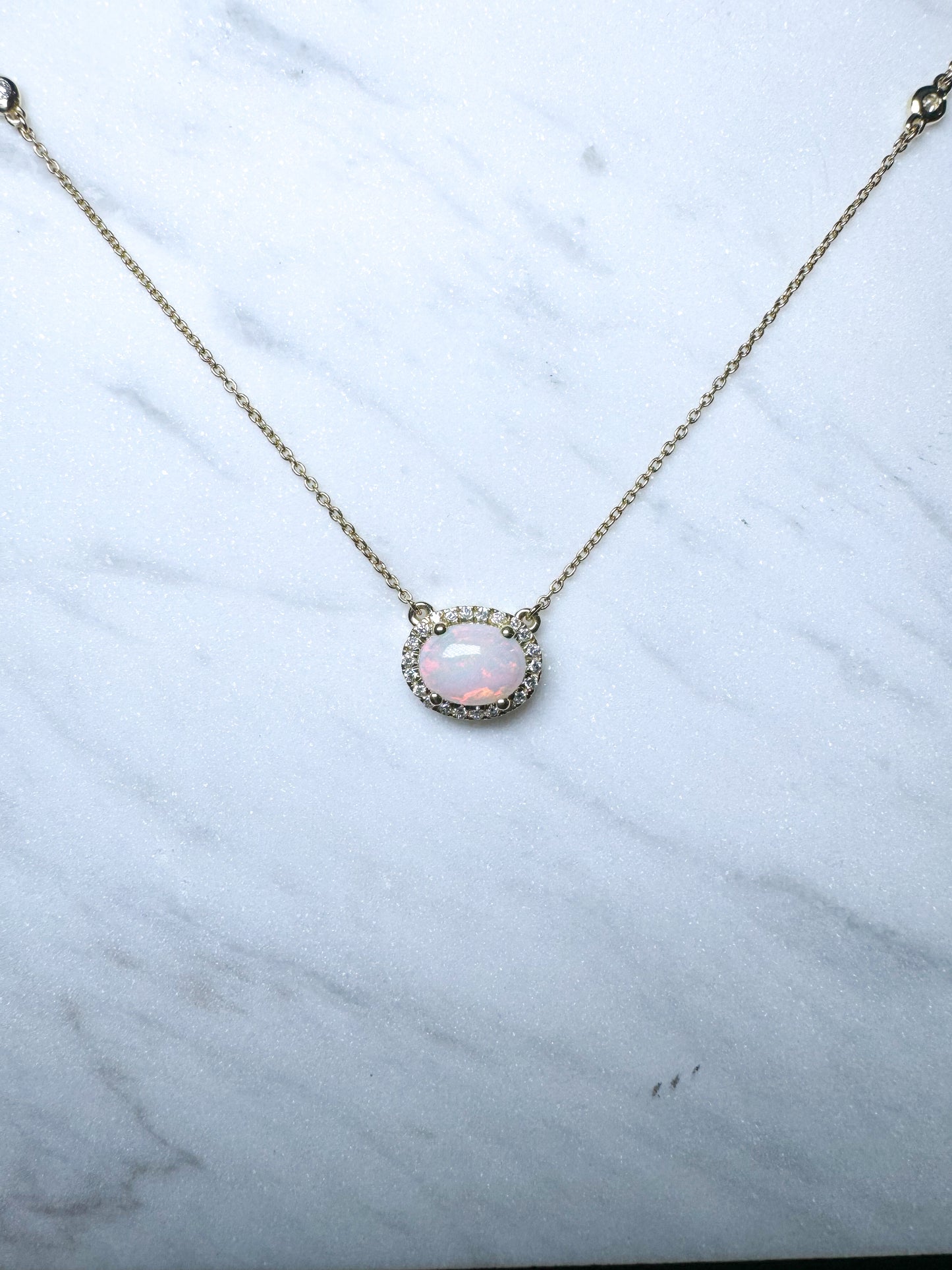 14K,yellow gold, .27 dtw natural diamond and opal pendant.