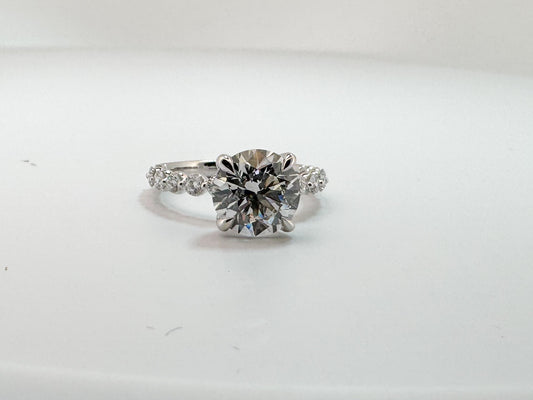 14K, white gold, 3.06 VS2 F Round brillioant set with .52 carats of side diamonds. IGI certified