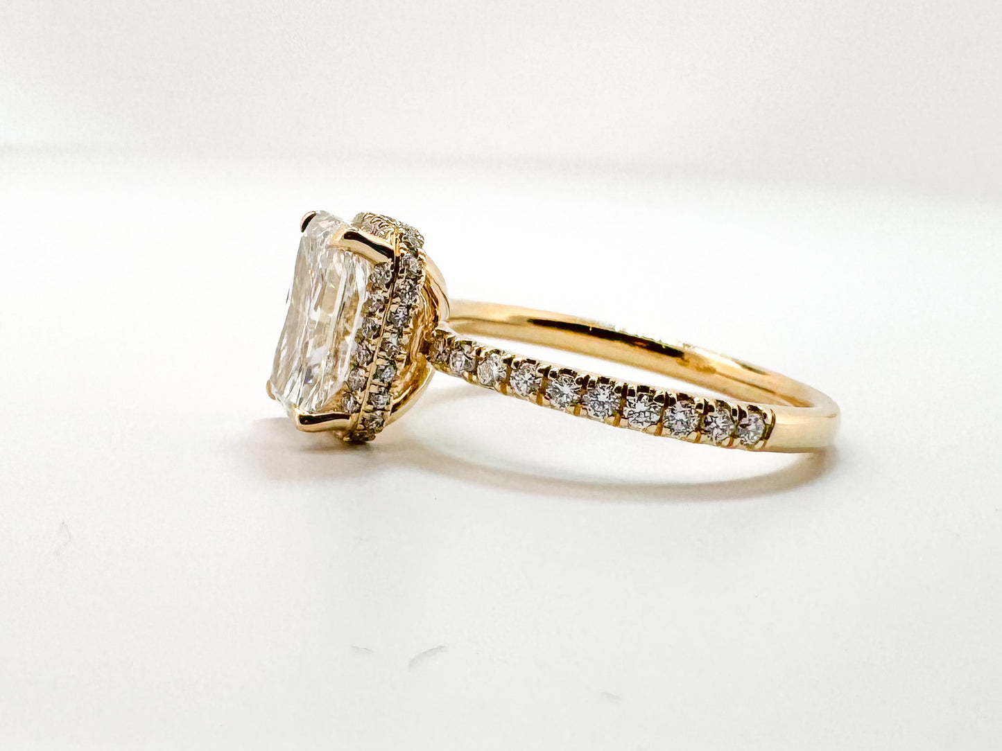 14K, yellow gold, 2.07 carat radiant cut lab grown diamond, set with .39 carats of side diamonds. IGI certified