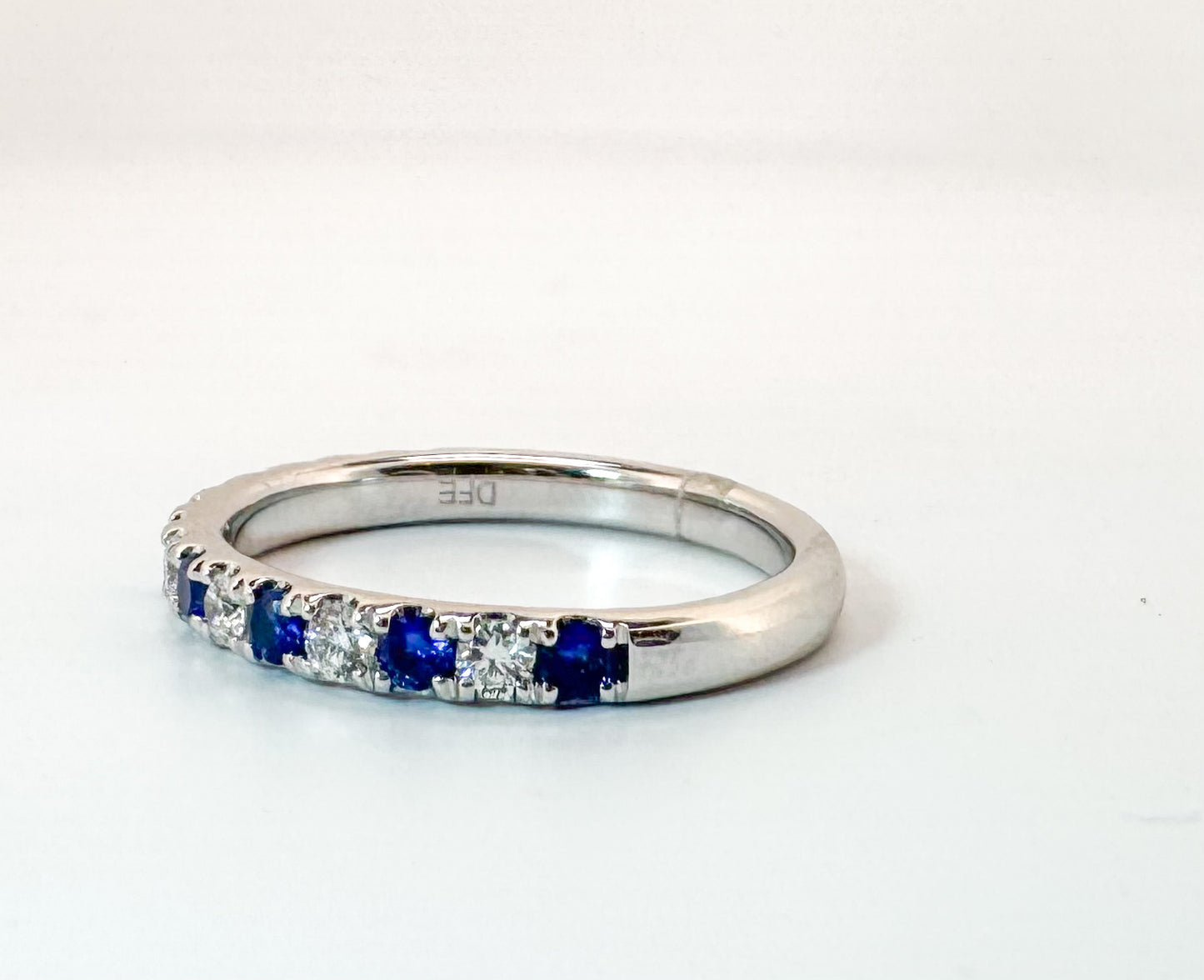 14k, White gold , sapphire and diamond band. .24 ctw diamond/ .48 ctw sapphire