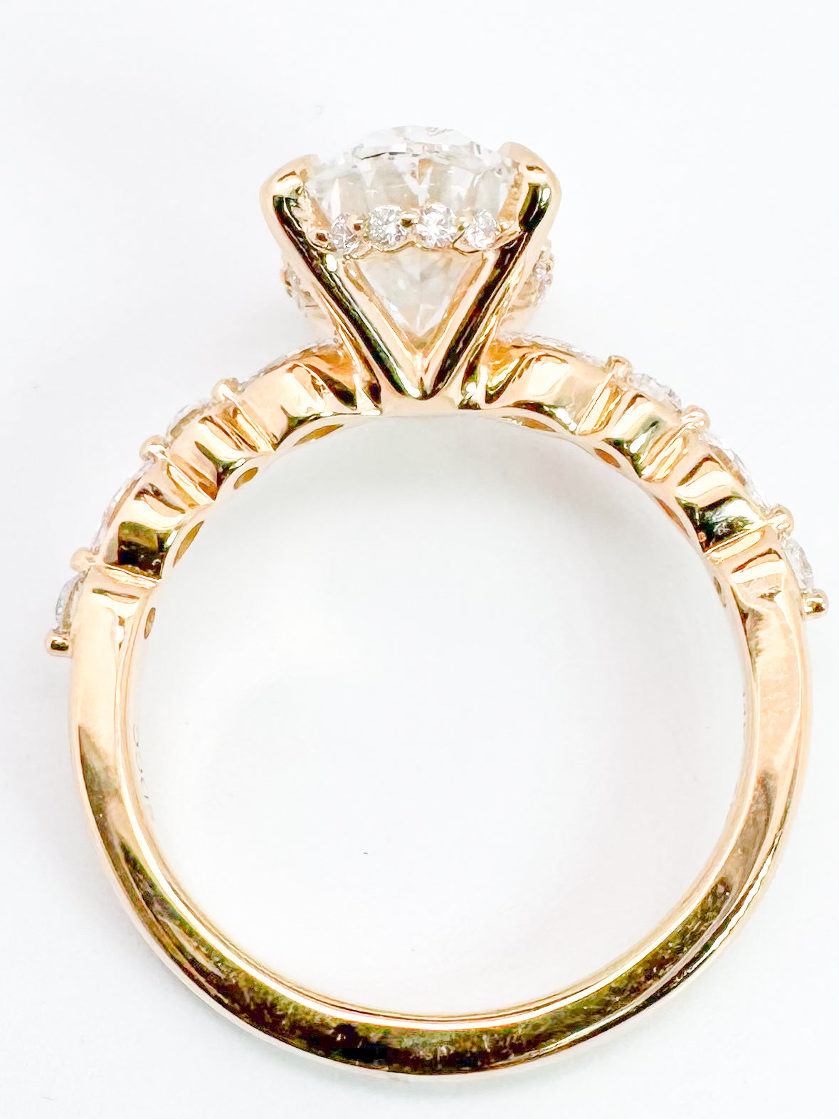 14K, 3.08 VVS2 E Lab grown oval set with .33 side diamonds. IGI Certified