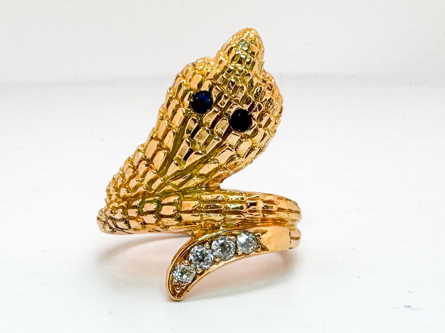 18k, yellow gold Vintage snake, serpent ring with .21 carats of side diamonds and .08 natural sapphire.