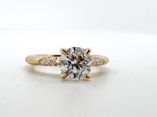 14k,Yellow gold, 1.50 natural round brilliant set in custom lace mounting.