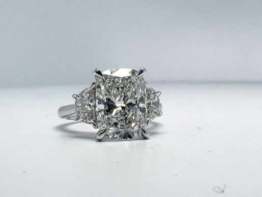 5.18 carat,  Lab grown cushion cut diamond set with .82 half moon side diamonds