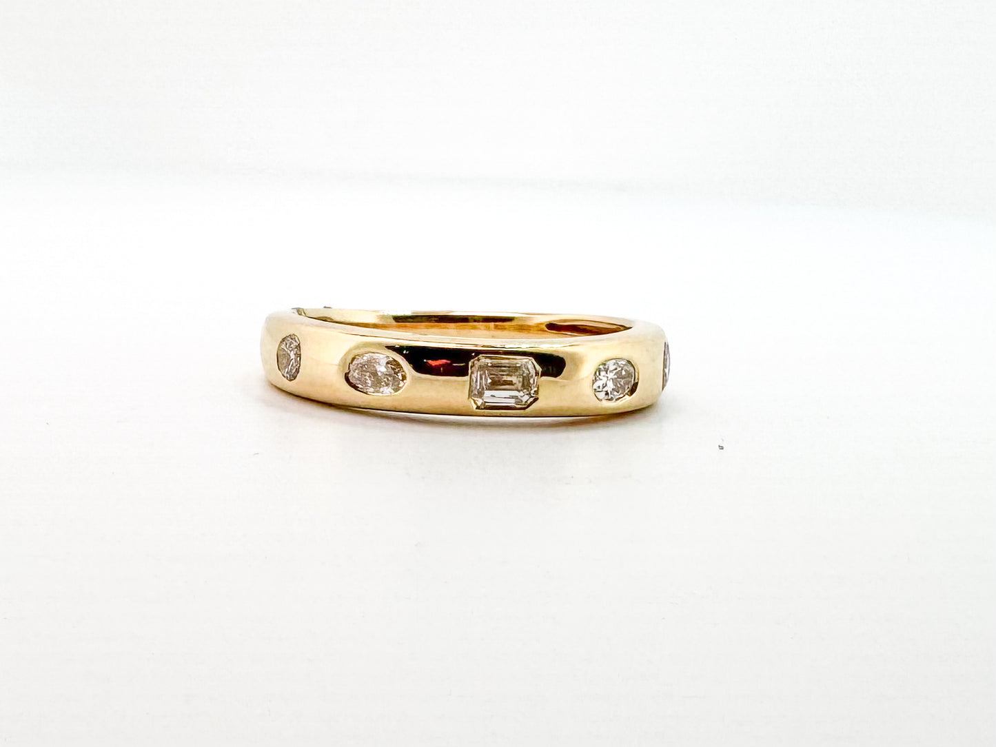14k, Yellow gold, flush set, multi diamond shape band. .50 diamond total weight.