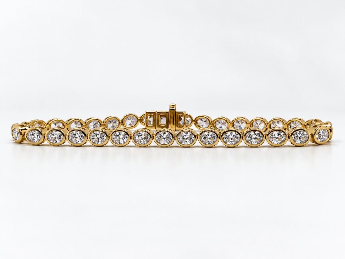 14k, Yellow gold, 4.95 carats of lab grown oval diamonds.  Tennis Bracelet