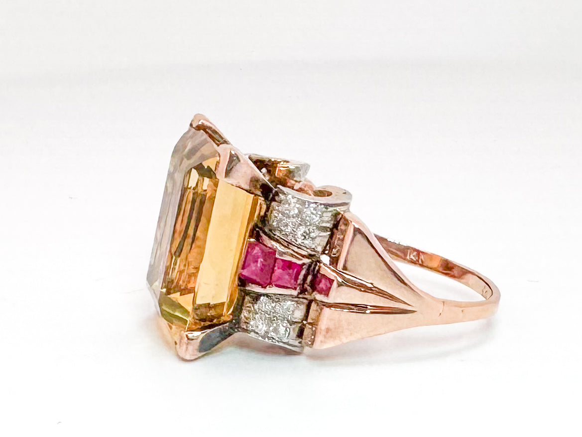 Platinum & 18k, Rose gold retro ring. 12.0 carat citrine, with .32 dtw flanked with syn ruby.